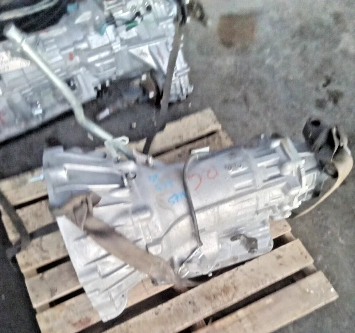 2008 INFINITI G37 3.7L coupe 2WD automatic transmission assembly with 57,753 miles on wooden pallet