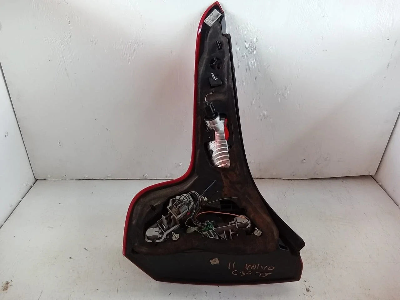 Rear right passenger side tail light assembly for 2007-2013 Volvo C30 T5 with black housing and red lens