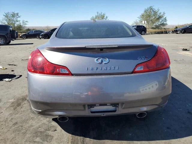 Rear view of silver 2008 INFINITI G37 coupe in a salvage yard