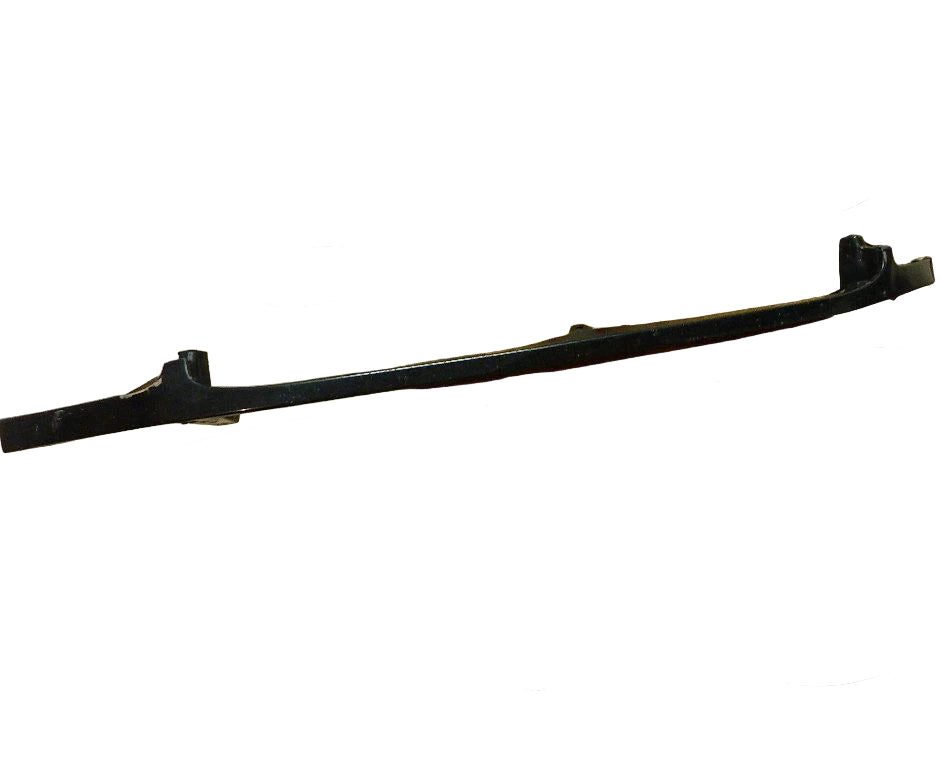 Toyota Tundra front right headlight filler OEM part on wooden table in kitchen