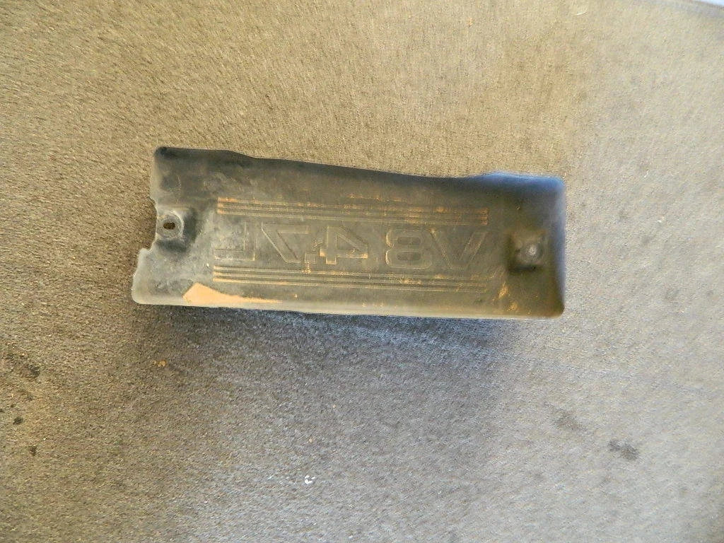 TOYOTA ENGINE COVER 4.7L V8 metal OEM part on gray surface