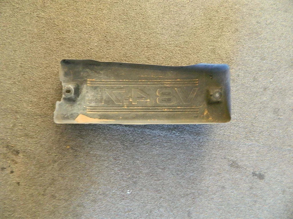Metal Toyota engine cover 4.7L V8 OEM part with 8V47 embossed design on textured surface