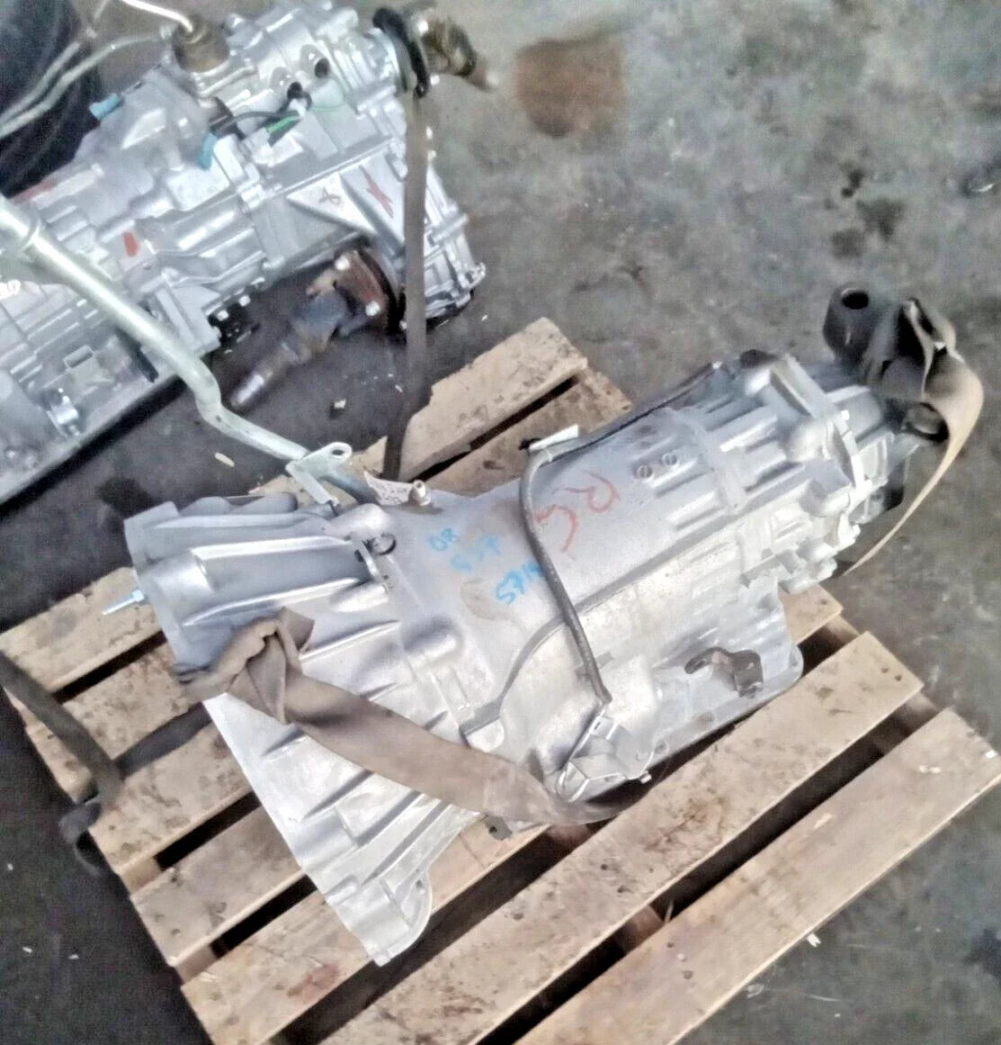 2008 INFINITI G37 3.7L automatic transmission assembly on wooden pallet with 57,753 miles