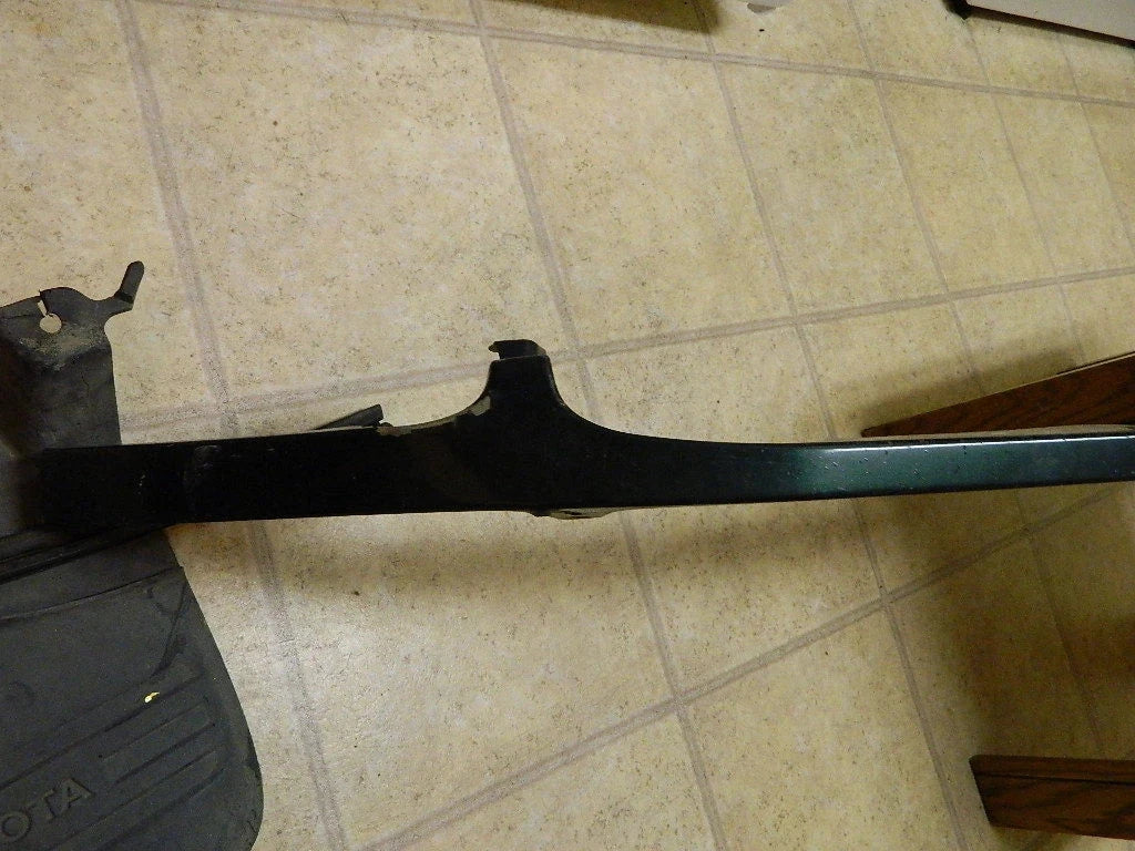 Toyota Tundra front right headlight filler OEM green part on tile floor