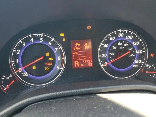 2008 INFINITI G37 dashboard showing 57753 miles with warning lights on